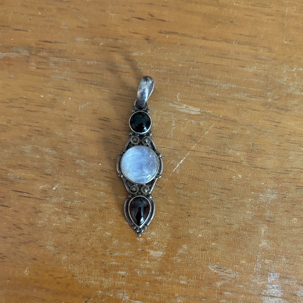 Elegant Sterling Silver Pendant with Moonstone and Black Accents